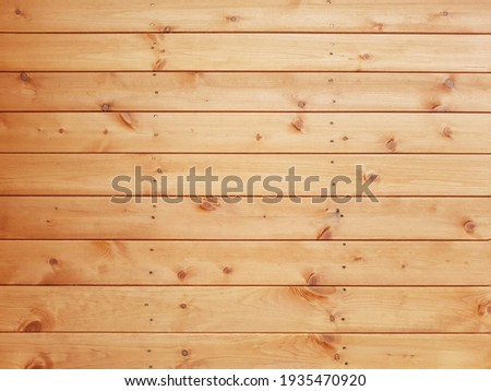  Light brown plank wood and has a natural pattern, wood wall texture background. Royalty-Free Stock Photo #1935470920