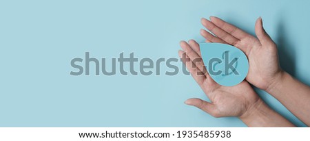 Woman hand holding smile water drop paper cut, world water day, clean water and sanitation, hand sanitizer and hygiene, washing hands, CSR, save water, clean renewable energy concept Royalty-Free Stock Photo #1935485938