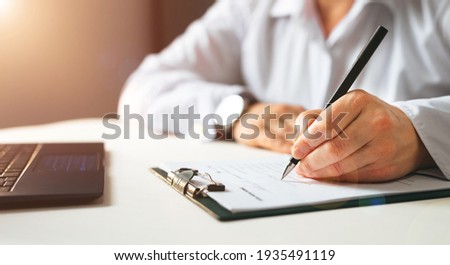 Businesswoman signing a document. Panoramic banner
