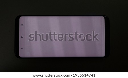 OLED burn in issue on a smartphone display Royalty-Free Stock Photo #1935514741