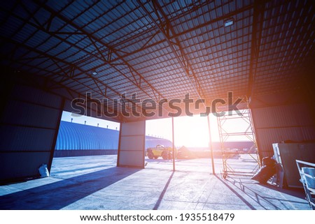 Industrial metallic construction at background with clear sky