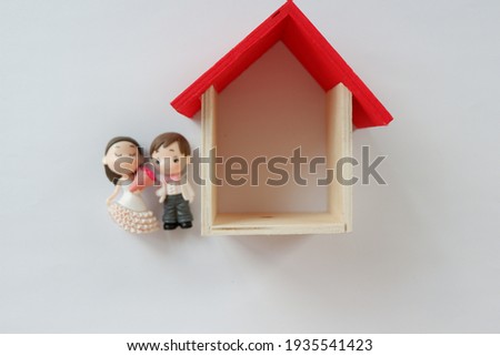 Wooden house with toys concept photo. 