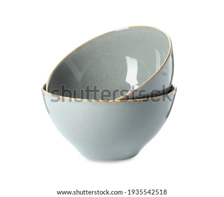 New grey ceramic bowls on white background Royalty-Free Stock Photo #1935542518