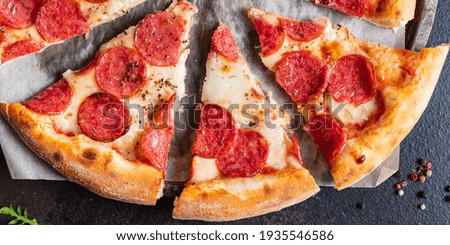 pizza salami or pepperoni sausage cheese filling fast food fresh bakery snack meal top view copy space for text food background rustic image