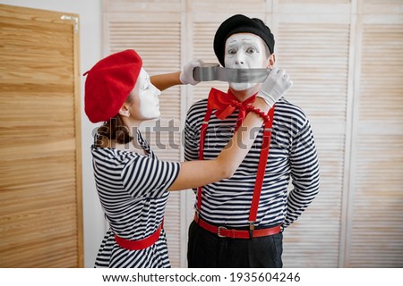 Two mime artists with duct tape, parody comedy