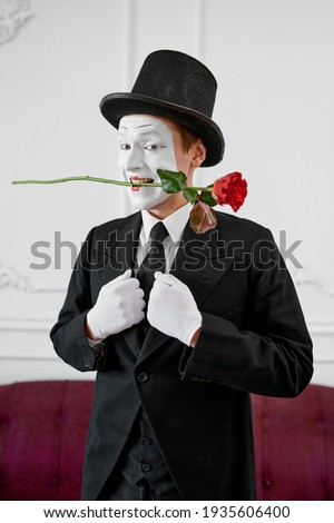 Mime artist, gentleman in love with a rose