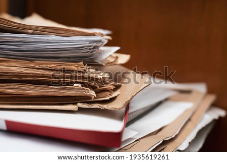 Old yellowed manuscripts lie in a stack, beautiful paper background, there is place for text. A book typed on a manual typewriter was brought to the publishing house to publish a book Royalty-Free Stock Photo #1935619261