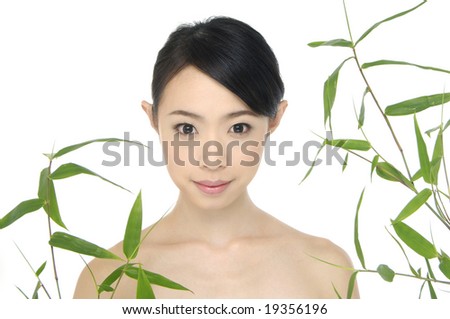 picture of lovely Asian young women with bamboo leaves