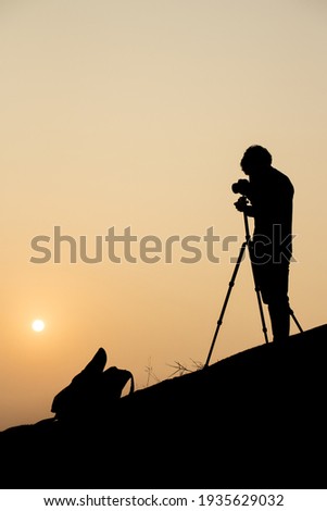 A photographer taking photo on the sunset on Garden Hill, Hong Kong