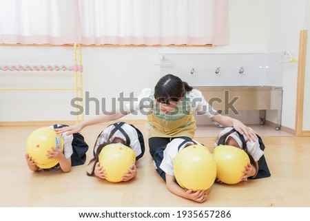 Children wearing a helmet image