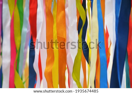 Multicolored strips of fabric fluttering in the wind