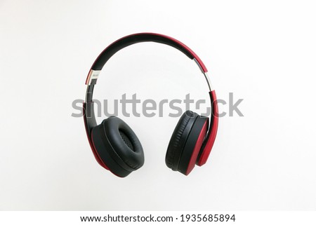 Red headphone isolate on white background. Royalty-Free Stock Photo #1935685894