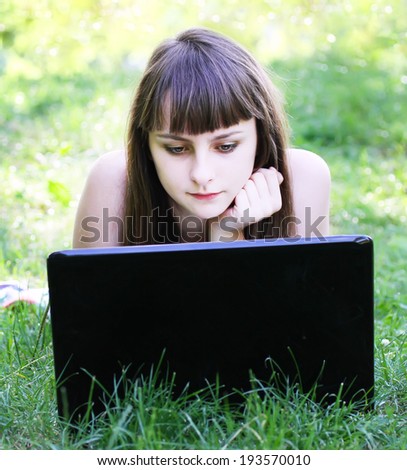 Beauty girl with laptop outdoors