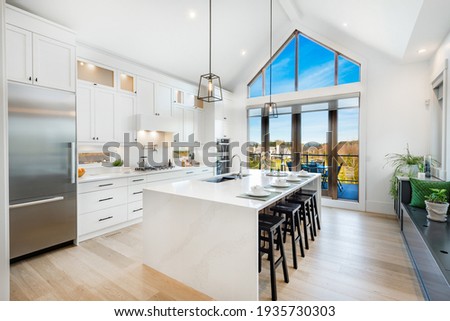 bright, spacious and modern farmhouse style kitchen Royalty-Free Stock Photo #1935730303