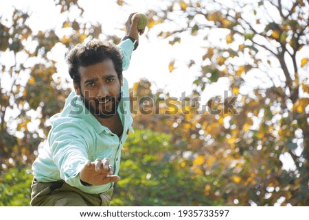 throwing Ball - Man With Cricket Ball while Playing Cricket