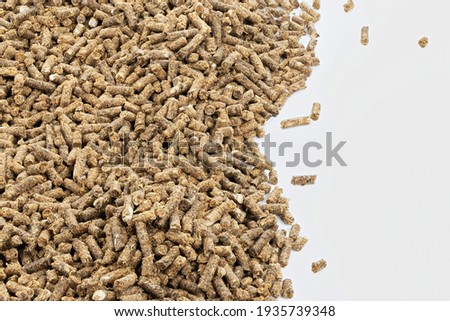 Feed for livestock. Pig feed pellets,feed  for hamster, rabbits or mouse on a white background. Top view. 
