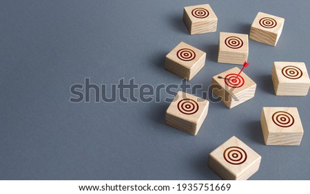 Red arrow hit one of targets circle. Direct shot, Bulls-eye, straight to the point. Direct marketing and targeting audience. Market research. Successful advertising strategy. Goal reach. Job search Royalty-Free Stock Photo #1935751669