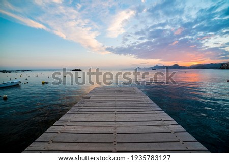 Wonderful sunset from a pier in Calabardina, Aguilas, Spain Royalty-Free Stock Photo #1935783127