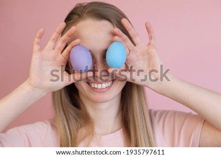 Happy funny blonde girl with Easter eggs. Easter consept.