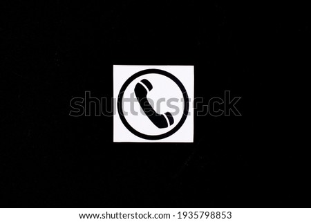 Phone icon, telephone symbol on a black background.