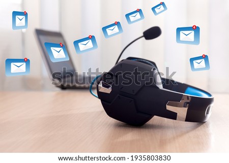 Headphones and laptop, concept for communication, customer service help desk, call center and it support. Contact us or Customer support hotline people connect. 