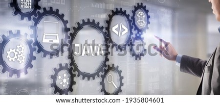 Business Man pushing on a touch screen interface Java Programming concept. Virtual machine
