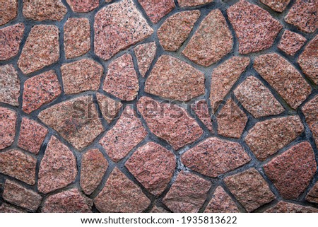 Wall of red stone, background, texture.