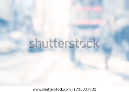 BLURRED CITY BUSINESS STREET WITH BLUR OF PEOPLE, MODERN URBAN BACKGROUND Royalty-Free Stock Photo #1935837901