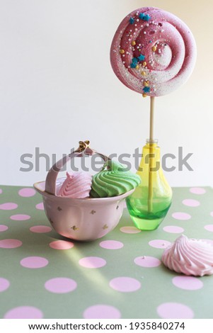Composition of French desserts in pink colors. Vertical image