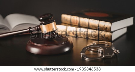 Judge gavel in court. Legal and justice concept. Library, books and handcuffs