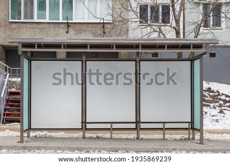 Modern glass public transport stop in the city. Background Royalty-Free Stock Photo #1935869239