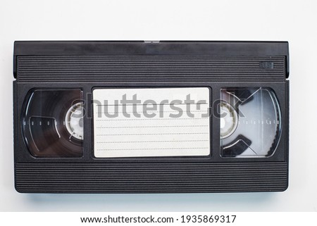 Old analog tape VHS cassette. Retro nostalgia. Vintage gone down in history. Royalty-Free Stock Photo #1935869317