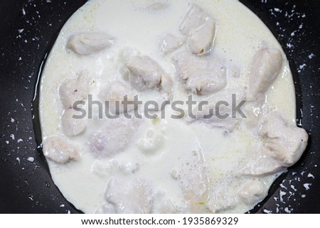 Stew chicken fillet in sour cream. Home cooking or culinary background abstract. Homemade dish.