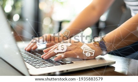 Businesspeople using a laptop, transfer money, pay for goods and services with a secure protection system. Online banking payment network. Royalty-Free Stock Photo #1935883579