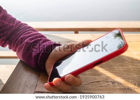 Woman using phone social connection, stock photo