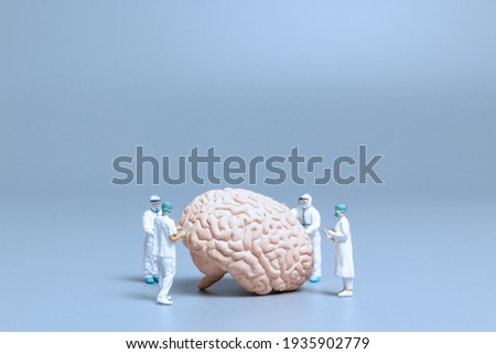 Miniature Doctor checking and analysis alzheimer's disease and dementia of brain, Science and medicine concept Royalty-Free Stock Photo #1935902779