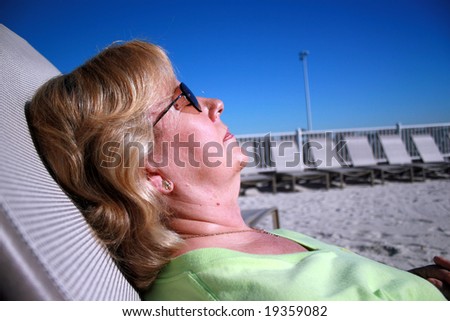 Carole sunbathing in Florida, relaxing in the sun.