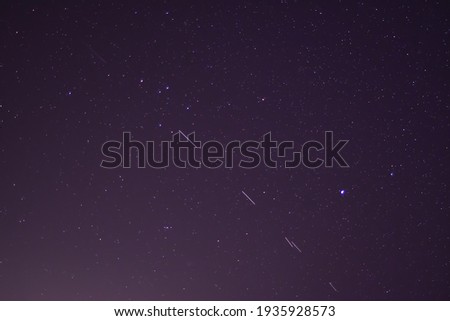 Starlink stellites in the  night sky.