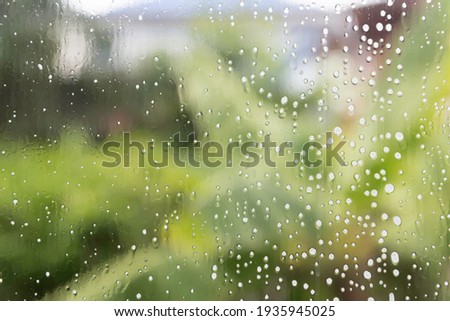 Water spray on glass Backdrop green