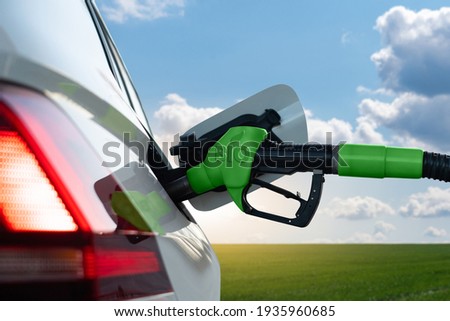 Refueling the car with biofuel Royalty-Free Stock Photo #1935960685