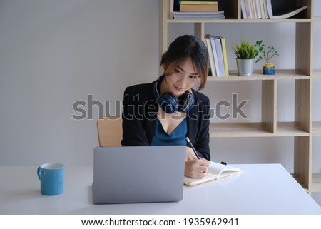 Homeschool. Asian girl student with pen and notebook for learning virtual internet online class. covid pandemic