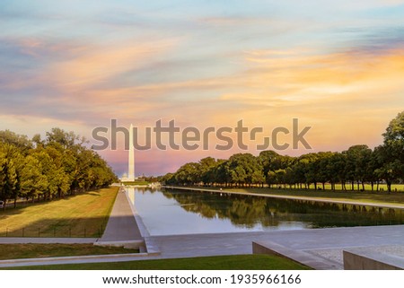 Washington monument reflected on the reflecting pool in nation mall, Washington DC, USA.