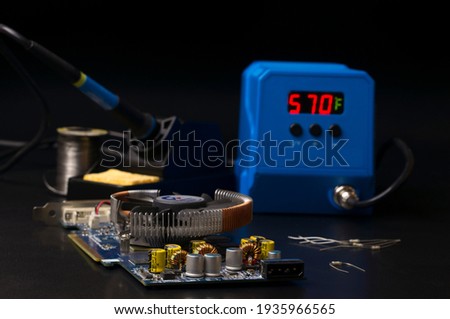 The workplace of an electronics repair technician in a service center. Abstract electronics repair background.
