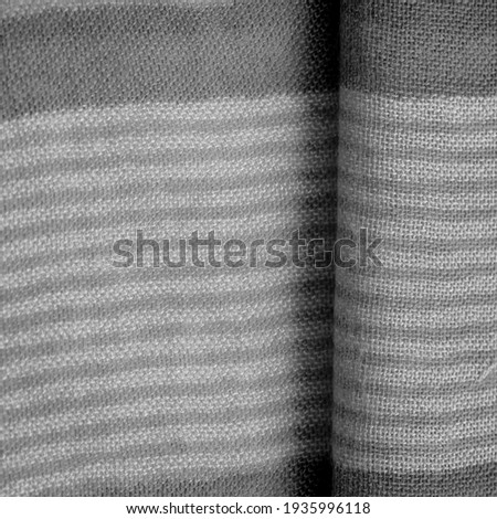 Texture. Background. Monochrome gray silk fabric, a photograph or picture developed or executed in black and white or in varying tones of only one color.