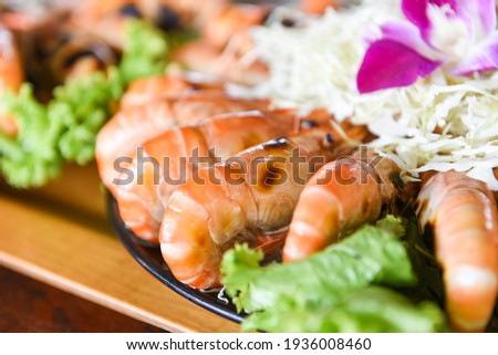 Grilled shrimp prawn with fresh vegetable and seafood sauce,  shrimps grilled serve on tray - seafood buffet Thai food 