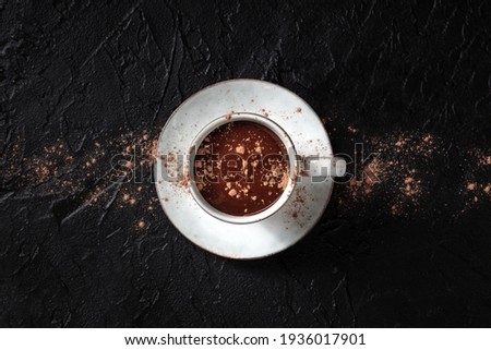 Hot chocolate with ground cocoa powder, overhead shot