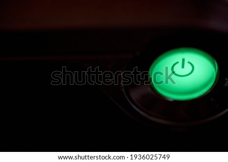 Cdznzofzcz green light button with sign turning on the computer. High quality photo