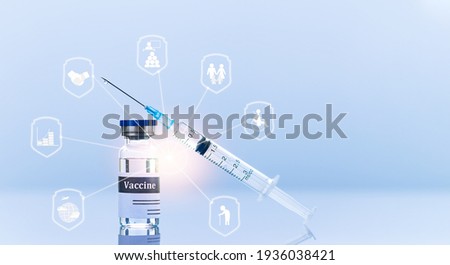Vaccine bottle and medical syringe with needle. Shield shaped icons, concept of defending against viruses and infections. Innovative technologies in medicine