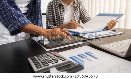 Business team brainstorming and discussing with financial data and report graph. Teamwork meeting working concept. Royalty-Free Stock Photo #1936045573