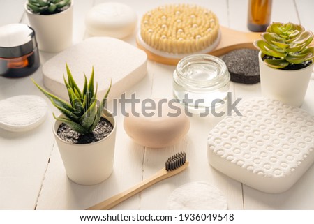 Zen and relax concept. Spa composition with treatment products on light background.